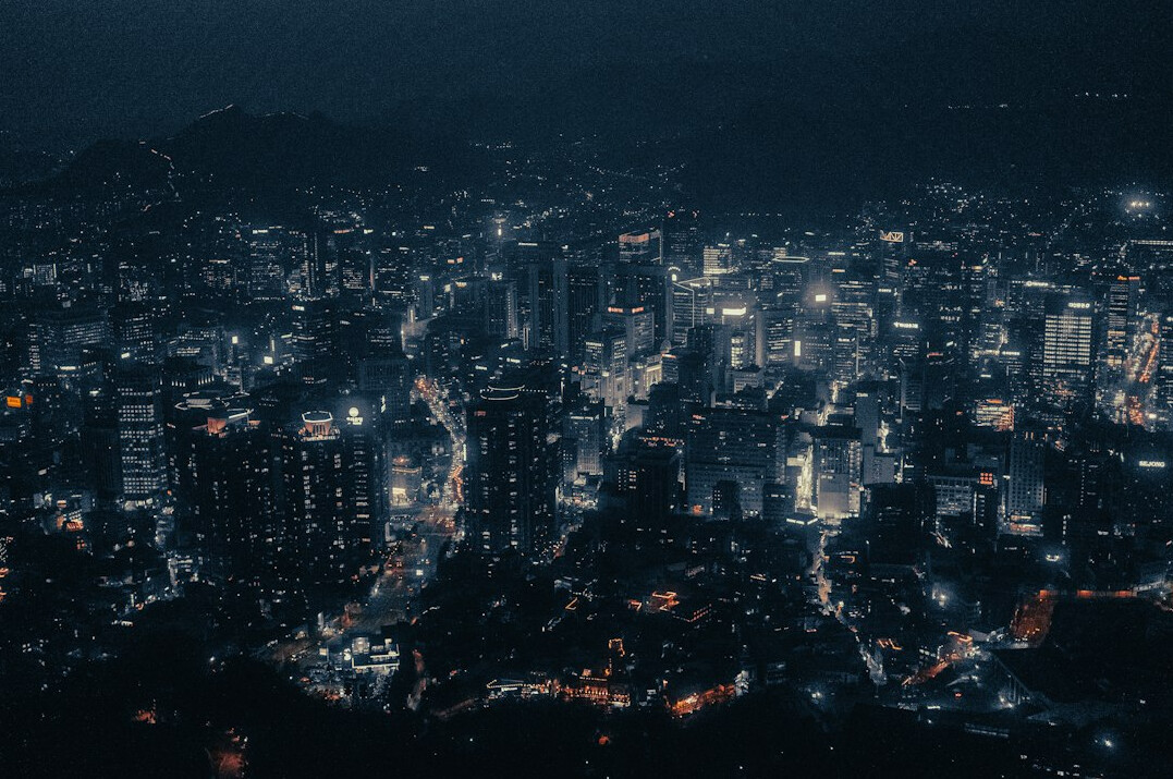 Aerial view of a dense city at dusk
