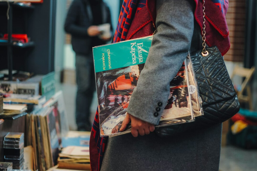 woman with large handbag in store