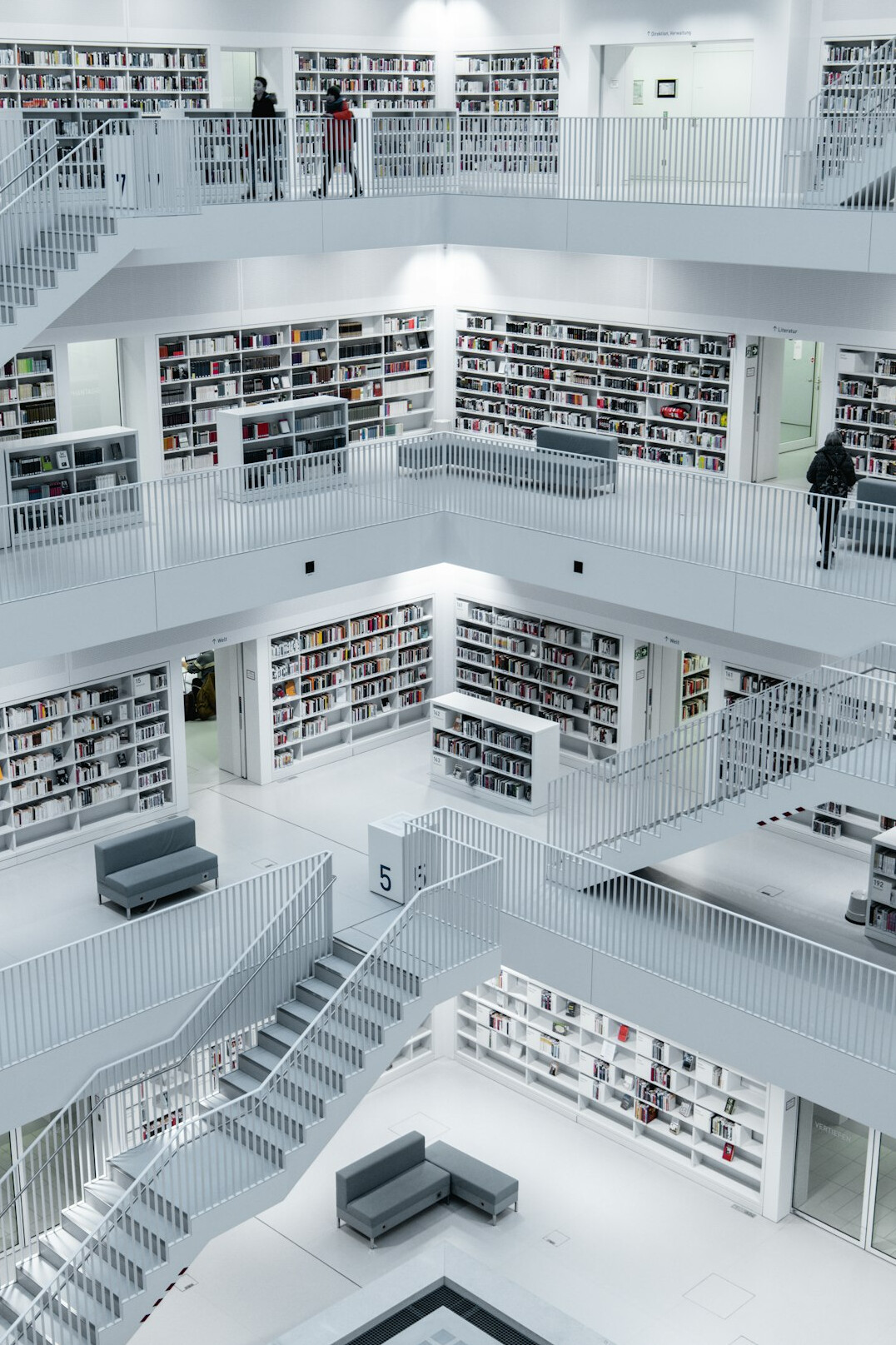 Bright library interior with tall bookshelves