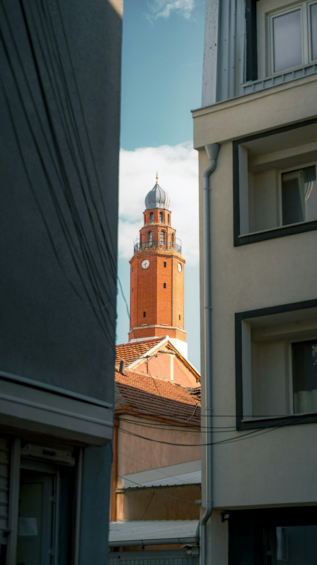 Narrow city street between old buildings